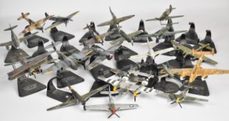Twenty-three Atlas Editions diecast model military aeroplanes, with display stands.