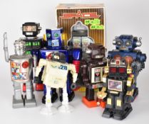 Eight battery operated toy robots, tallest 30cm.
