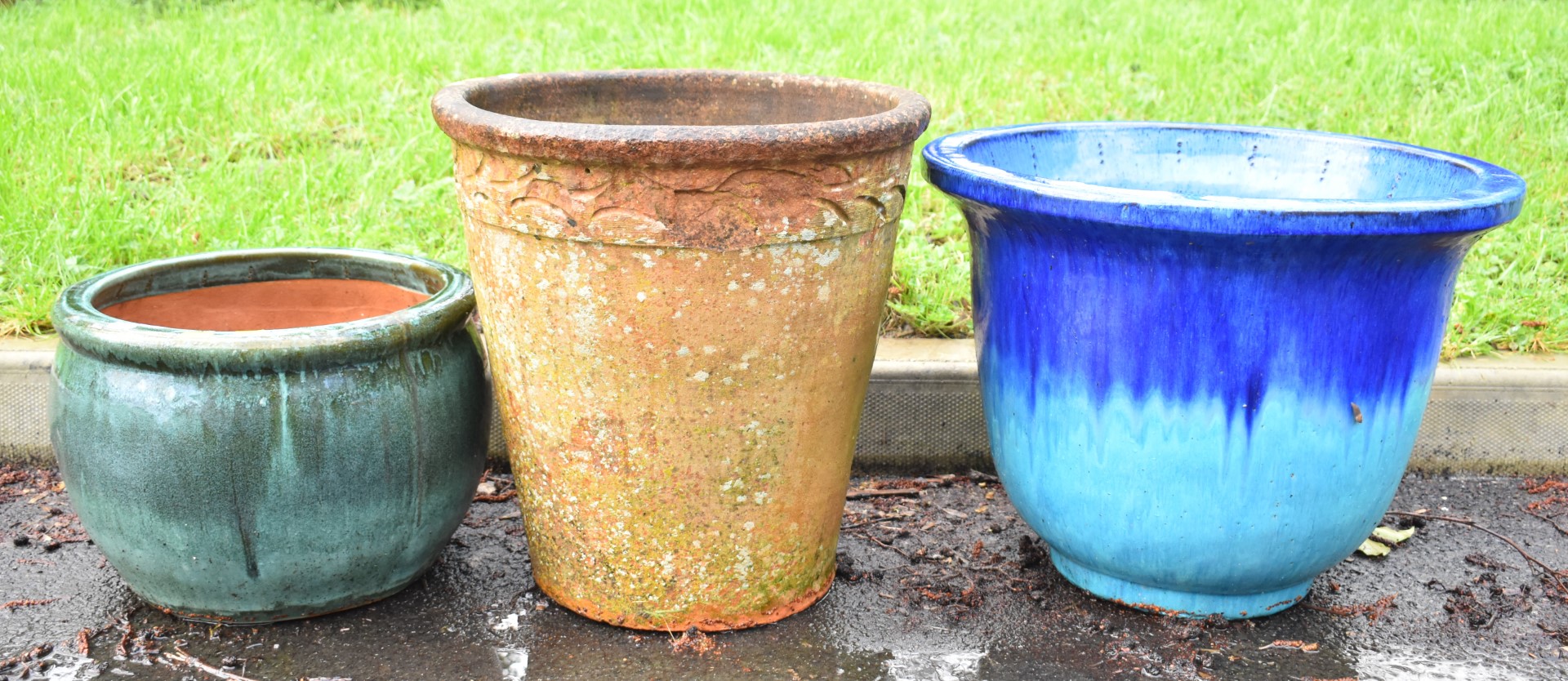 Four jardinières / garden planters including large green / blue glazed examples and a terracotta