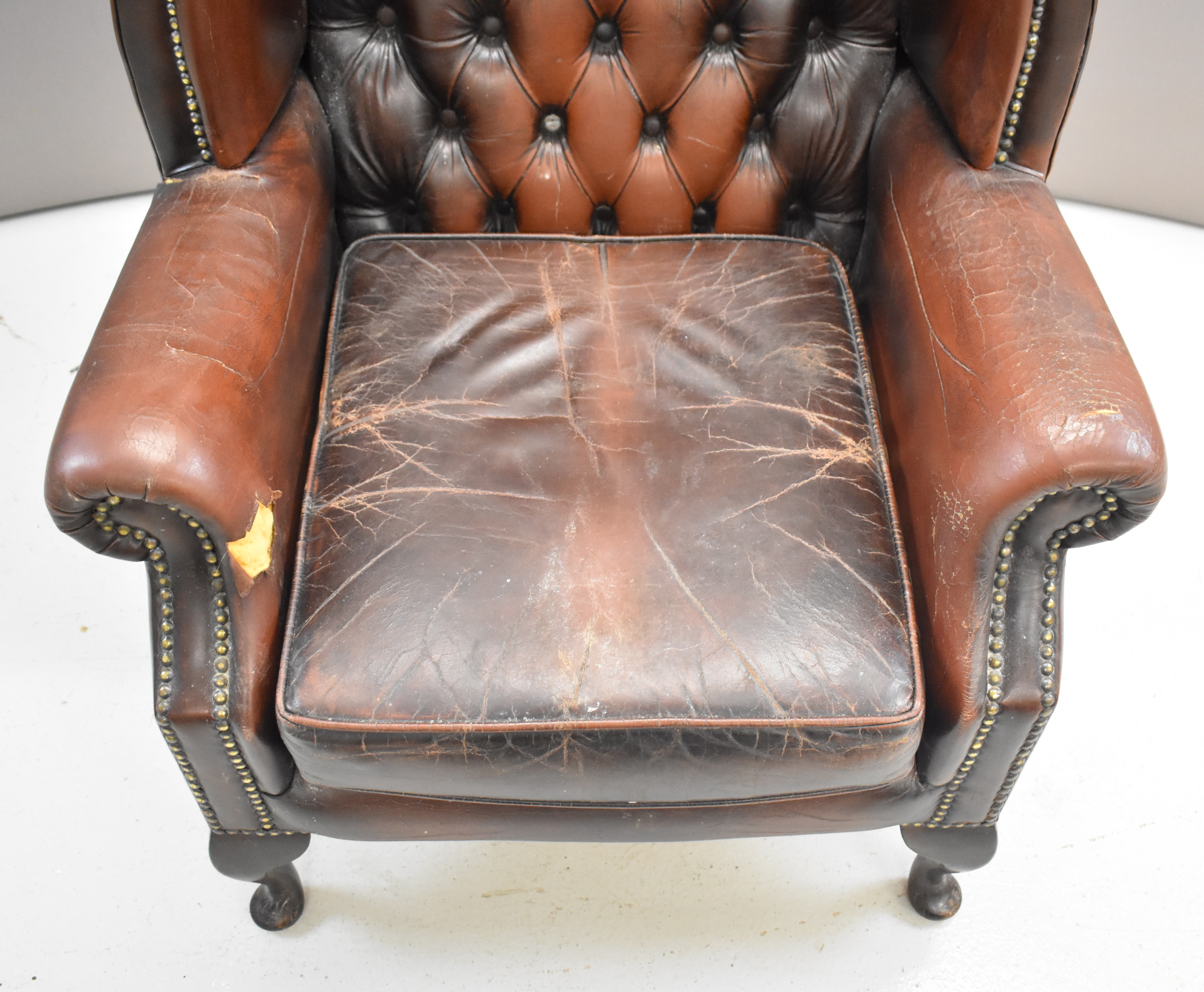 Brown leather Chesterfield wing back armchair raised on cabriole legs, height 105cm - Image 5 of 5