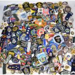 Large collection of overseas cloth and metal police badges and rank insignia including Spain,