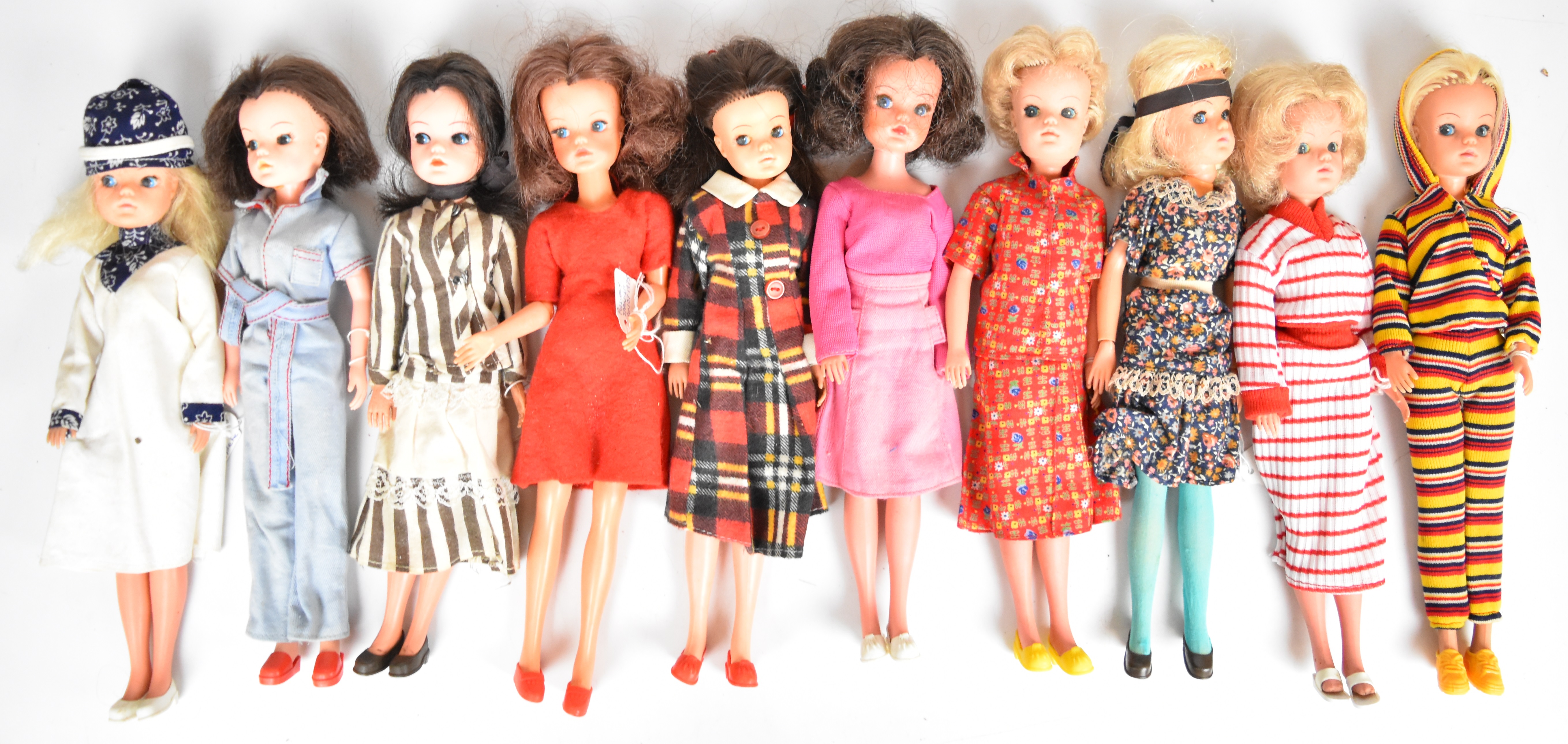 Ten vintage Sindy dolls by Pedigree dressed in original 1970's outfits.