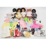 Five Gotz Sasha Baby dolls including one earlier sexed model, together with a collection of clothing