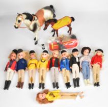 Ten vintage Sindy dolls by Pedigree dressed in 1980's equestrian outfits together with two horses