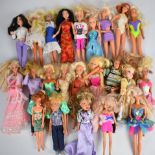 Twenty Barbie, Sindy, Bratz and similar fashion dolls dressed in sports and evening wear, some