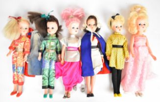 Six vintage Sindy dolls by Pedigree dressed in 1970's & 80's outfits to include Nurse, Space