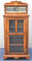 19thC rosewood music cabinet with shelf above a bevelled mirror, having glazed main door opening