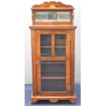 19thC rosewood music cabinet with shelf above a bevelled mirror, having glazed main door opening