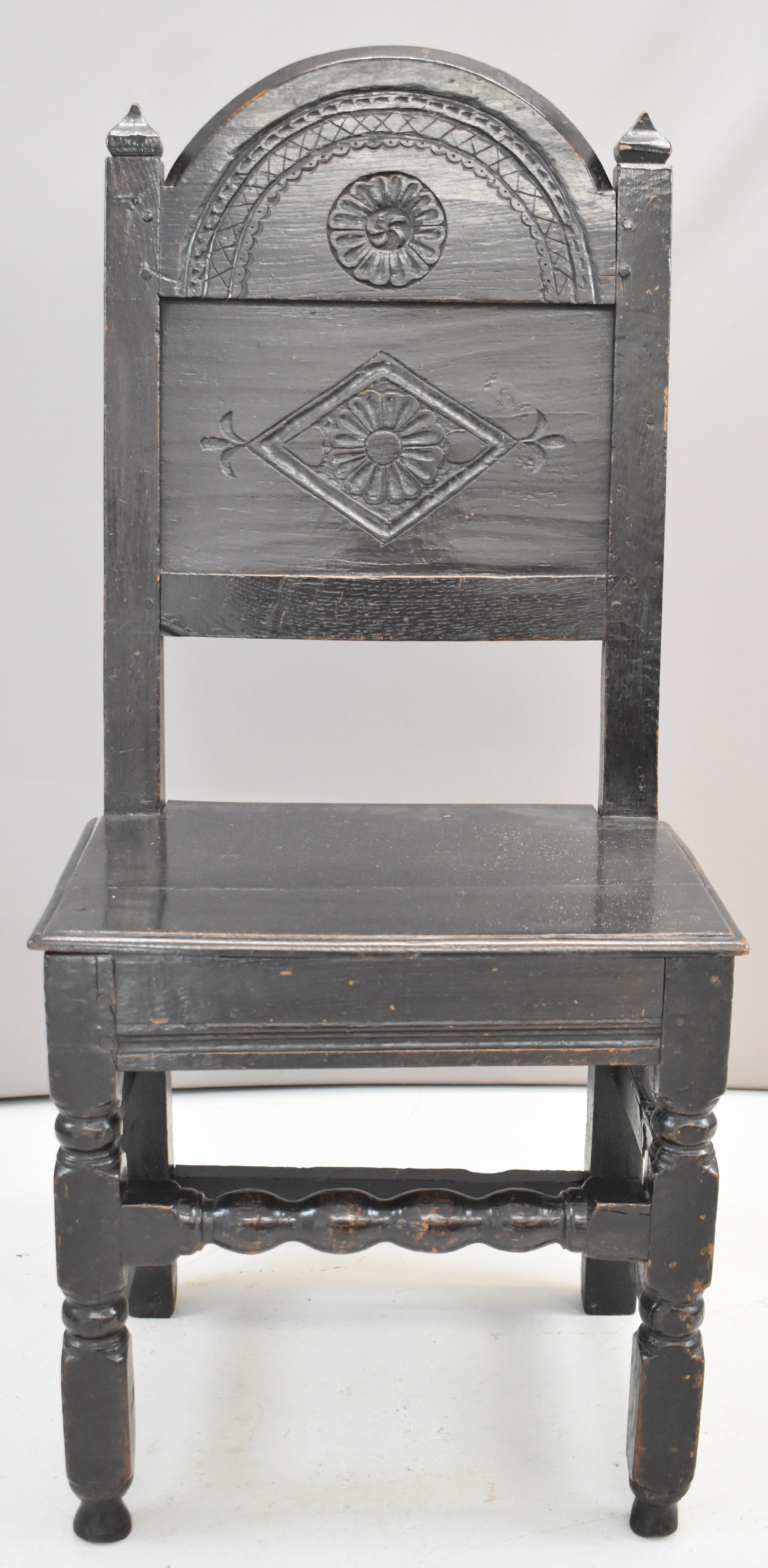 17th / 18thC carved oak peg jointed country chair with plank seat, bobbin strainer and turned