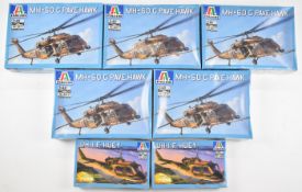Seven Italeri 1:72 and 1:48 scale plastic model helicopter kits comprising two UH-I F Huey 1229