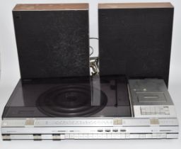 Bang & Olufsen Beocentre 4600 including record player, cassette deck and radio, with a pair of