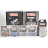 A collection of Star Wars X-Wing wargaming miniatures comprising two core base sets, Servants of