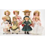 Eight MBI and Danbury Mint Shirley Temple dolls on stands, including Wee Willy Winky and Heidi,