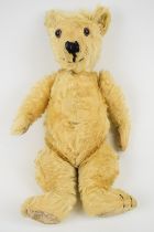 Vintage Teddy bear with golden mohair, disc joints, shaved snout and stitched features, height