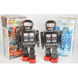 Two battery operated tinplate 'Super Moon Explorer' robots by HK Toys, height 30cm, in original