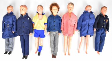 Seven vintage Paul Sindy dolls by Pedigree dressed in 1960's clothing.