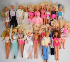 Twenty Mattel Barbie dolls dressed in a range of evening, sports and casual clothing.