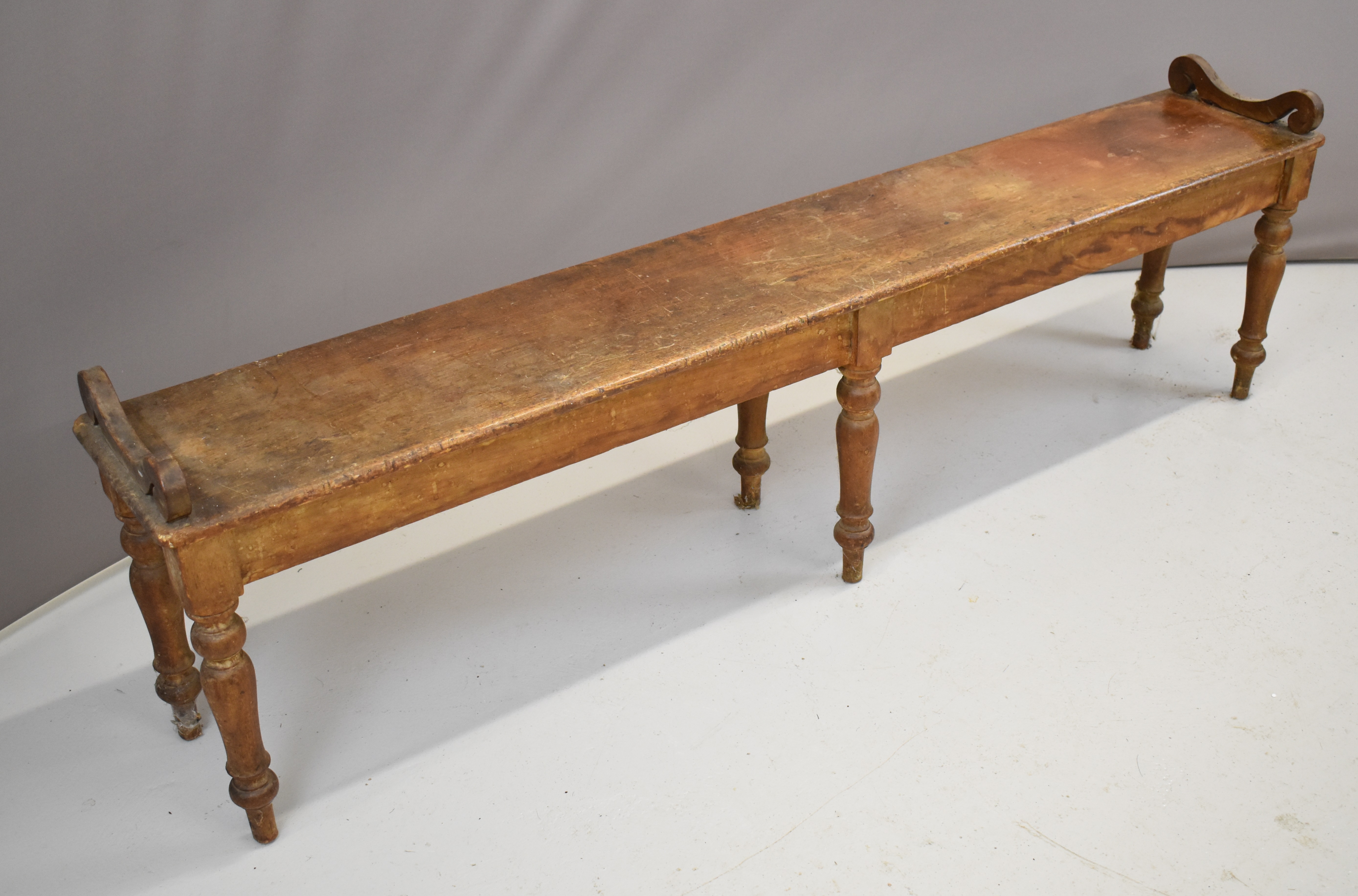 19thC ash window seat or low bench with scroll ends, raised on six turned legs, W193 x D30 x H46cm - Image 2 of 4