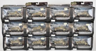 Twelve Unimax Forces of Valour 1:72 scale diecast model Iraqi T72 tanks (Baghdad 2003), all in