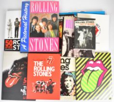 Collection of Rolling Stones books including unopened 'Exhibitionism' catalogue with carrier bag