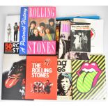 Collection of Rolling Stones books including unopened 'Exhibitionism' catalogue with carrier bag