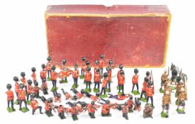 A collection of Britains metal soldiers to include Scots Guard and kilted regiments.
