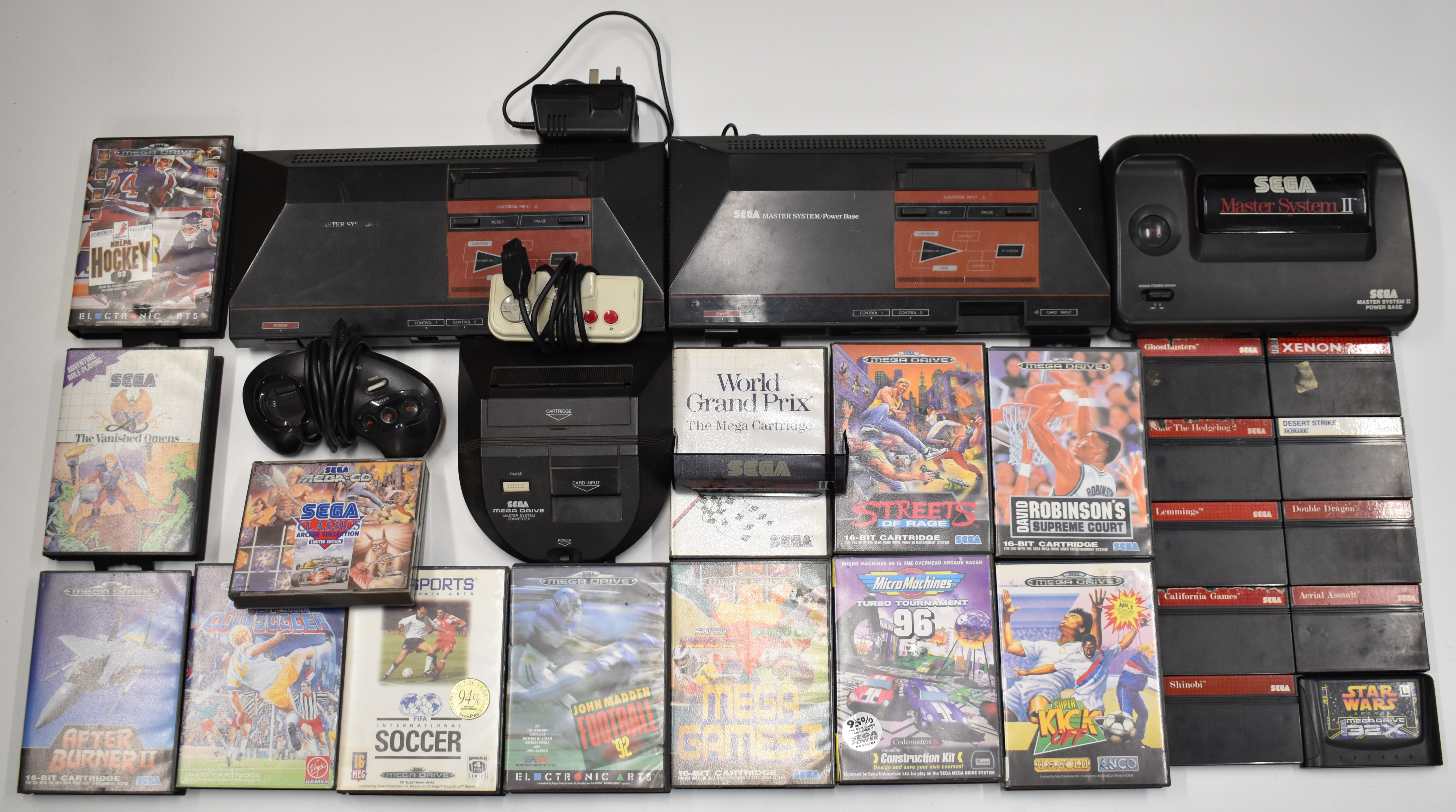 Three Sega retro video game consoles together with a collection of 22 Master System and Mega Drive
