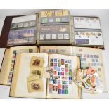 Five volumes of GB and world stamps including mint Queen Elizabeth II and presentation packs,