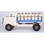 Tri-ang pressed steel milk truck or float with white cab and blue bed, complete with milk bottles.