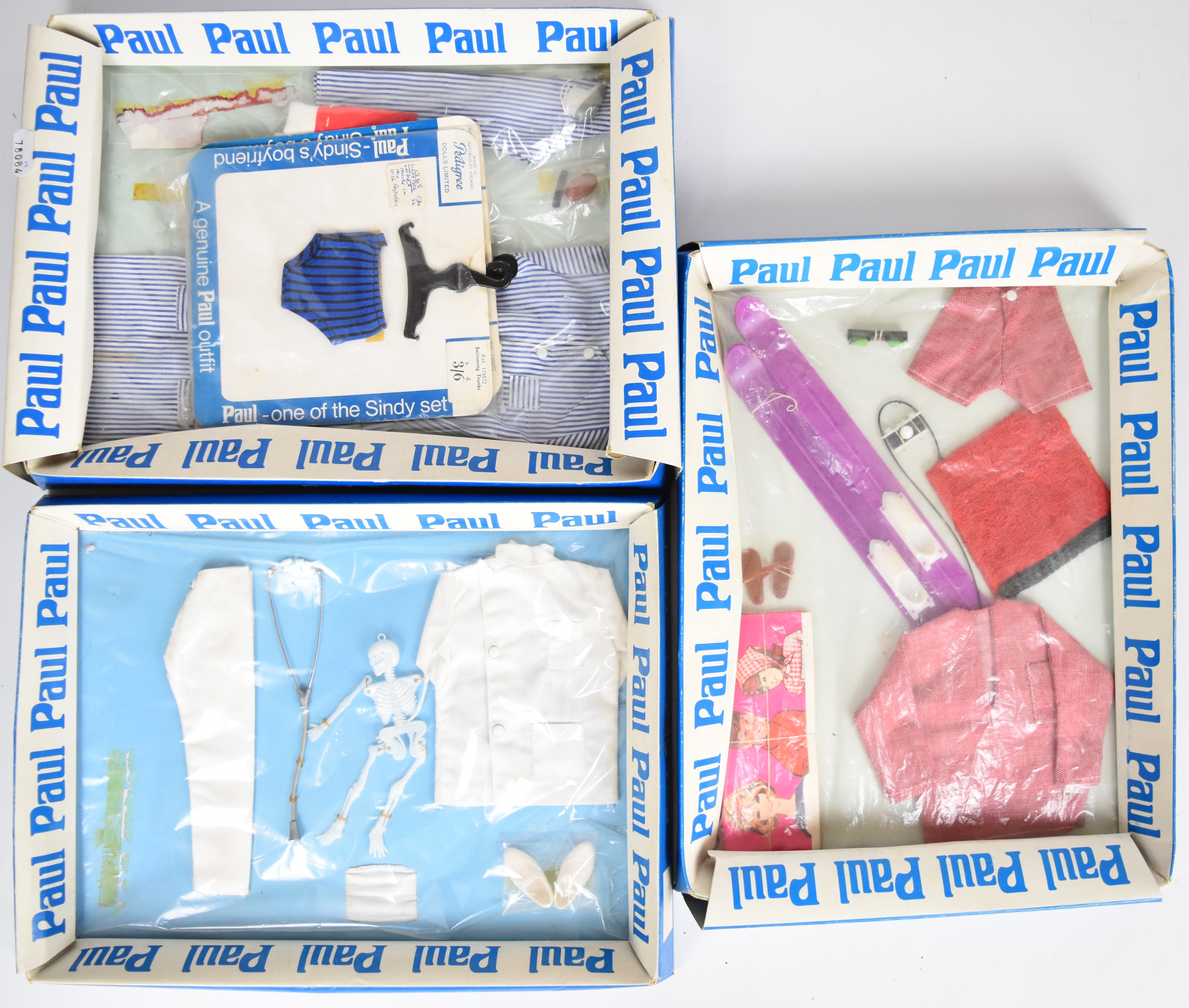 Three 1960's Pedigree Sindy Paul doll clothing packs comprising Doctor, Bedtime and Skiing