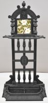 Victorian cast iron stick stand with removable drip tray and Wedgwood tile back, height 90.5cm
