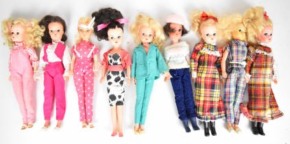 Nine vintage Sindy dolls by Pedigree dressed in 1980's outfits to include Well Suited, Fashion