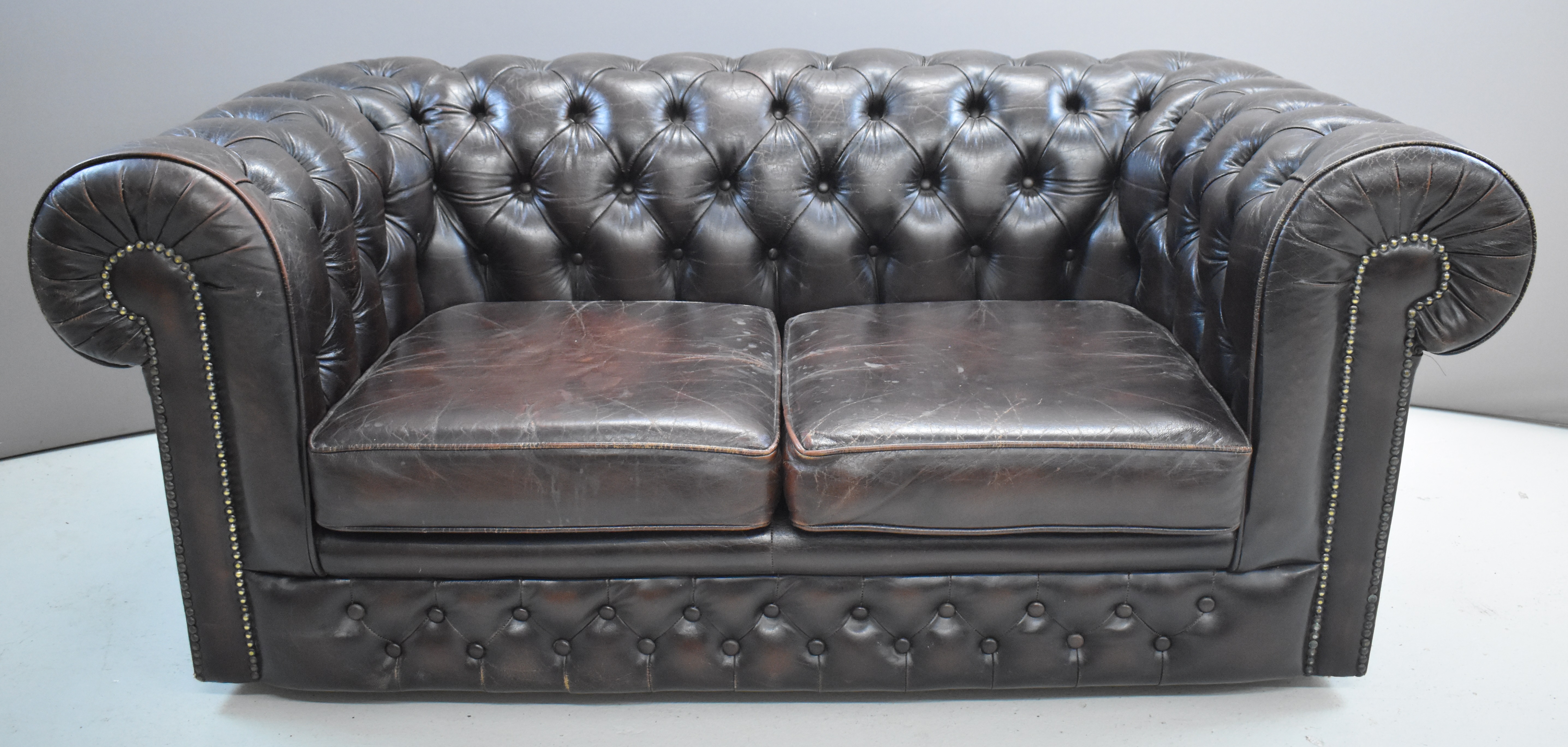 Brown leather Chesterfield two seater sofa, width 160 x height 70cm