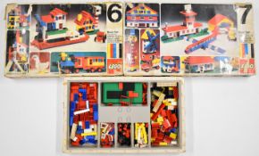 Two early Lego starter sets comprising kits 6 and 7 and a collection of loose bricks.