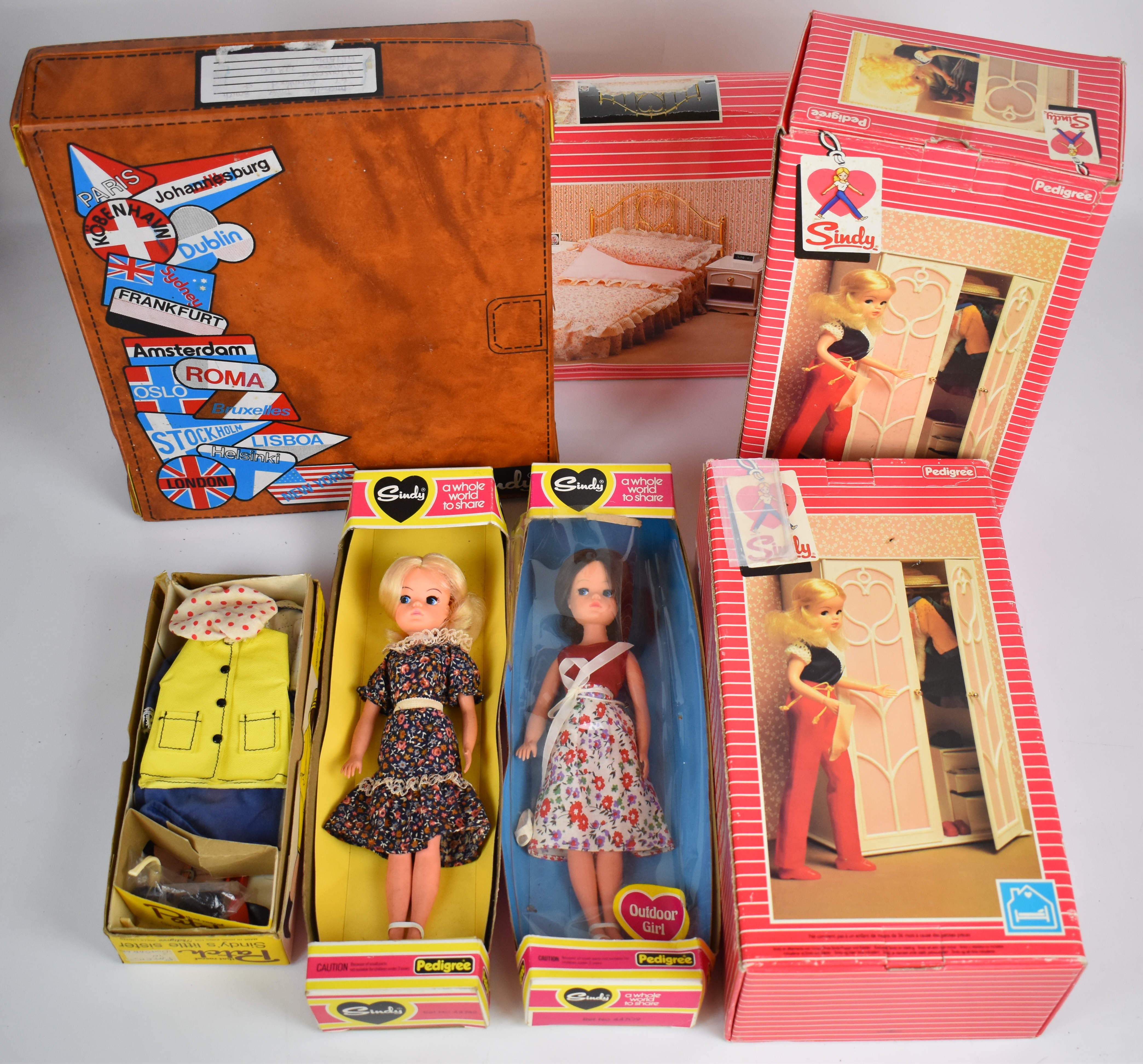 A collection of vintage Sindy items comprising two dolls, furniture, clothing and accessories,