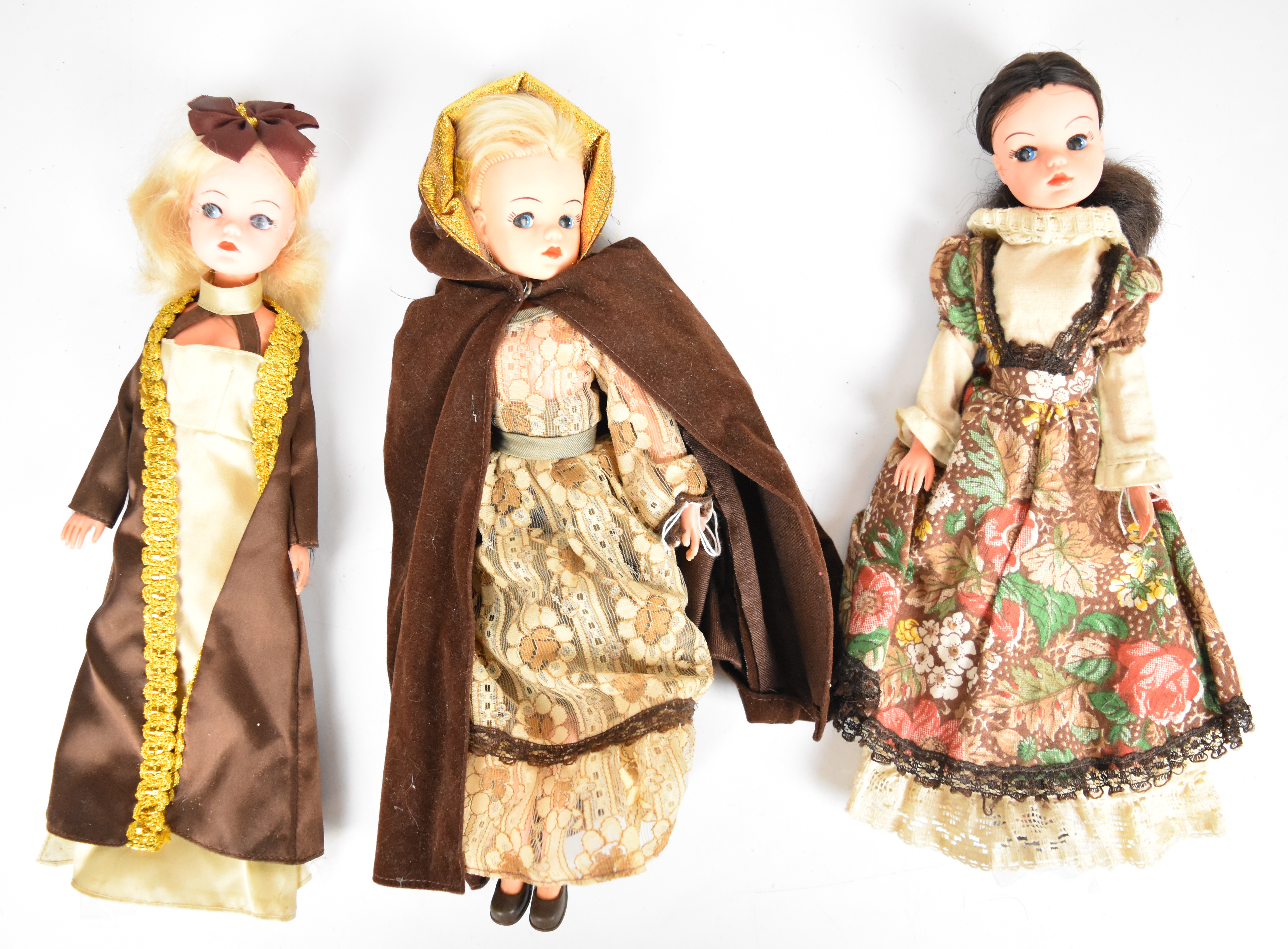 Three vintage Sindy dolls by Pedigree dressed in 1970's outfits to include My Fair Lady.