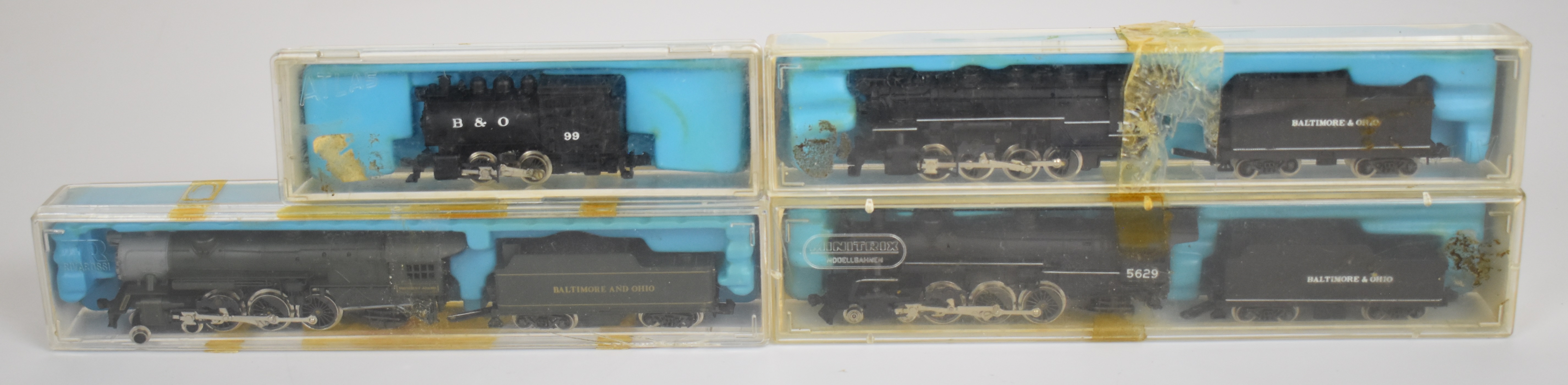 Four Atlas and Rivarossi N gauge model railway locomotives comprising 0-8-0 IHB 2112, 4-6-2- GW
