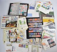 A collection of GB and world stamps in three stock albums, and GB presentation packs and first day