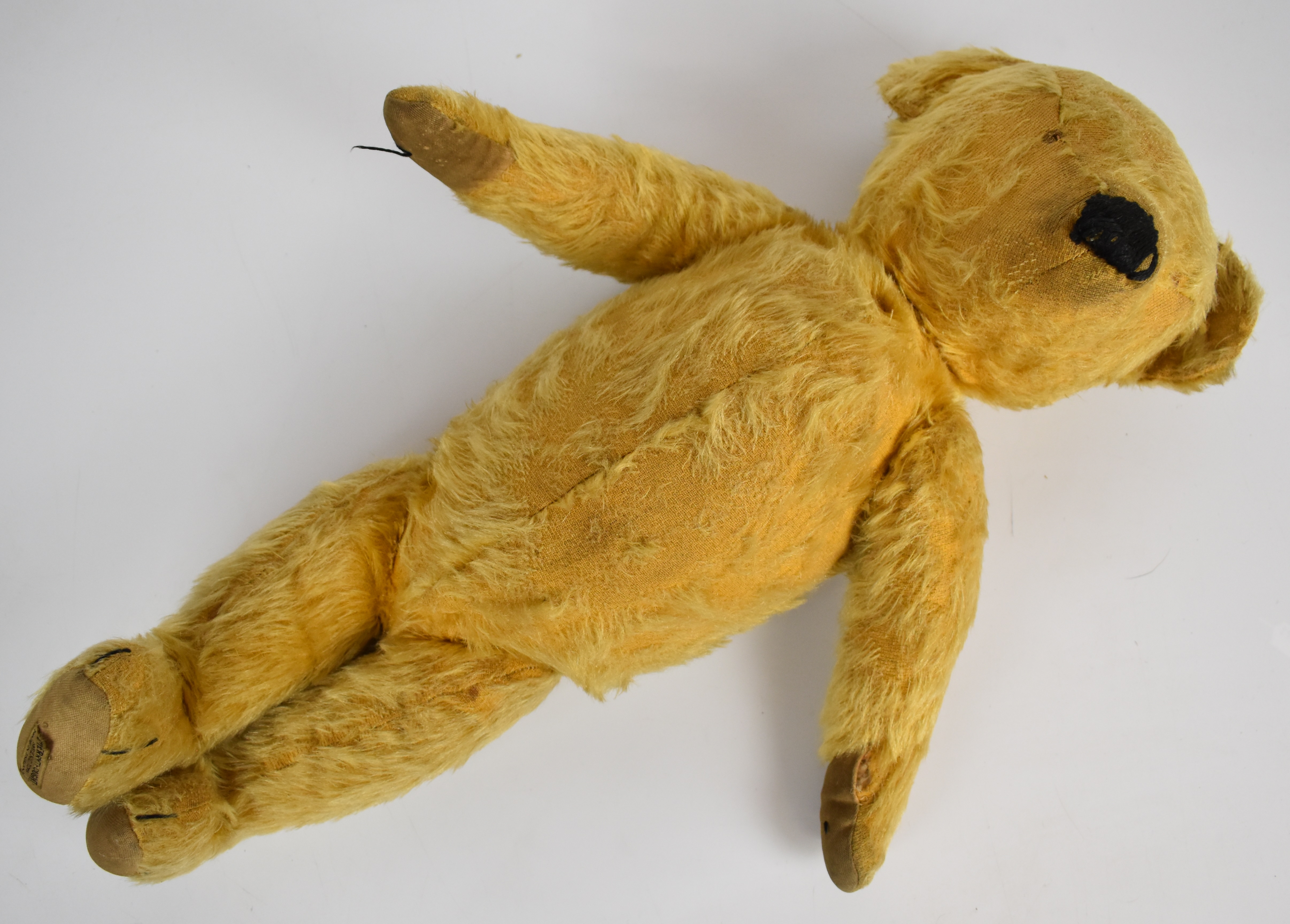 Merrythought Teddy bear with blonde mohair, disc joints, button in ear, shaved snout and stitched