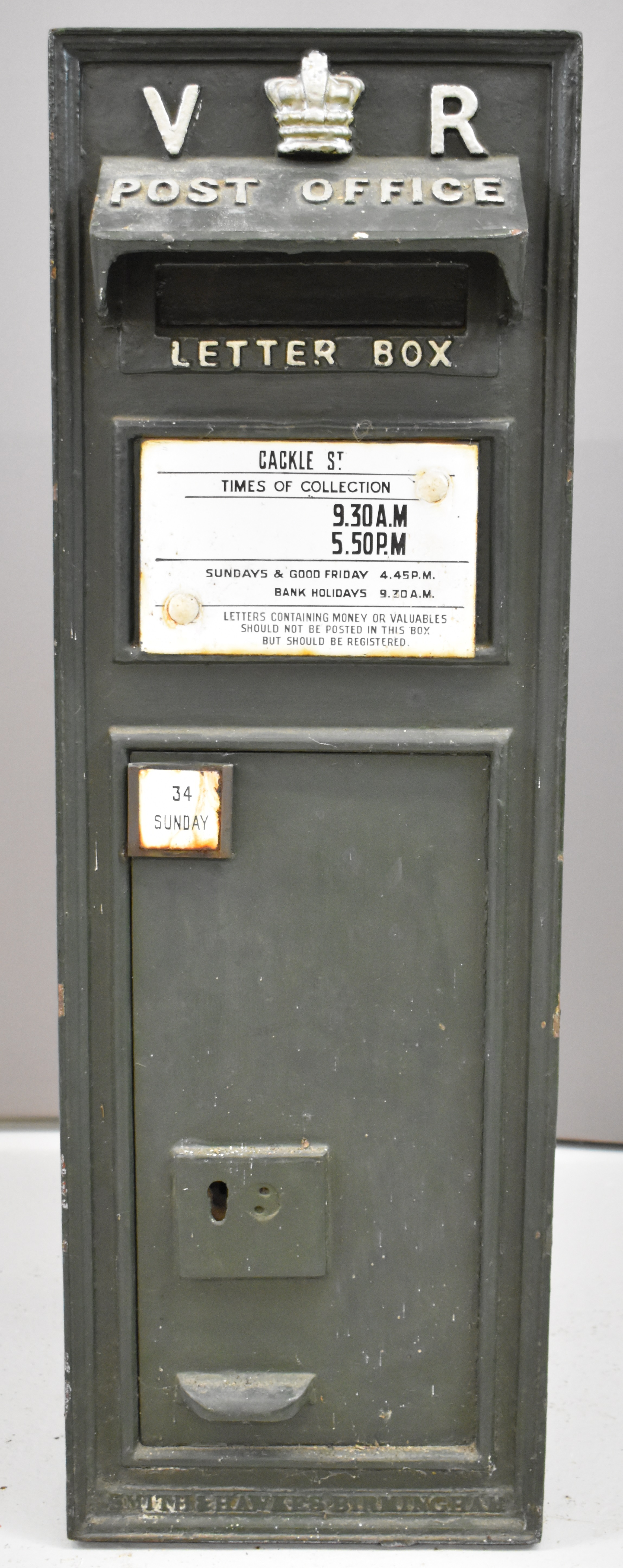 Victorian cast iron wall mounted letter box with VR cypher and crown to top, marked below the door