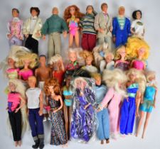 Twenty-five Mattel Barbie dolls dressed in a range of evening, sports and casual clothing.