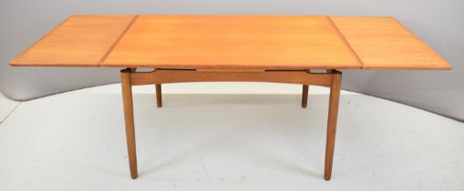 Retro mid century modern teak draw leaf table with two additional leaves, raised on turned legs,