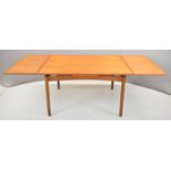 Retro mid century modern teak draw leaf table with two additional leaves, raised on turned legs,