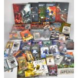 A collection of Citadel Games Workshop Warhammer 40K and similar figurines, rulebooks and