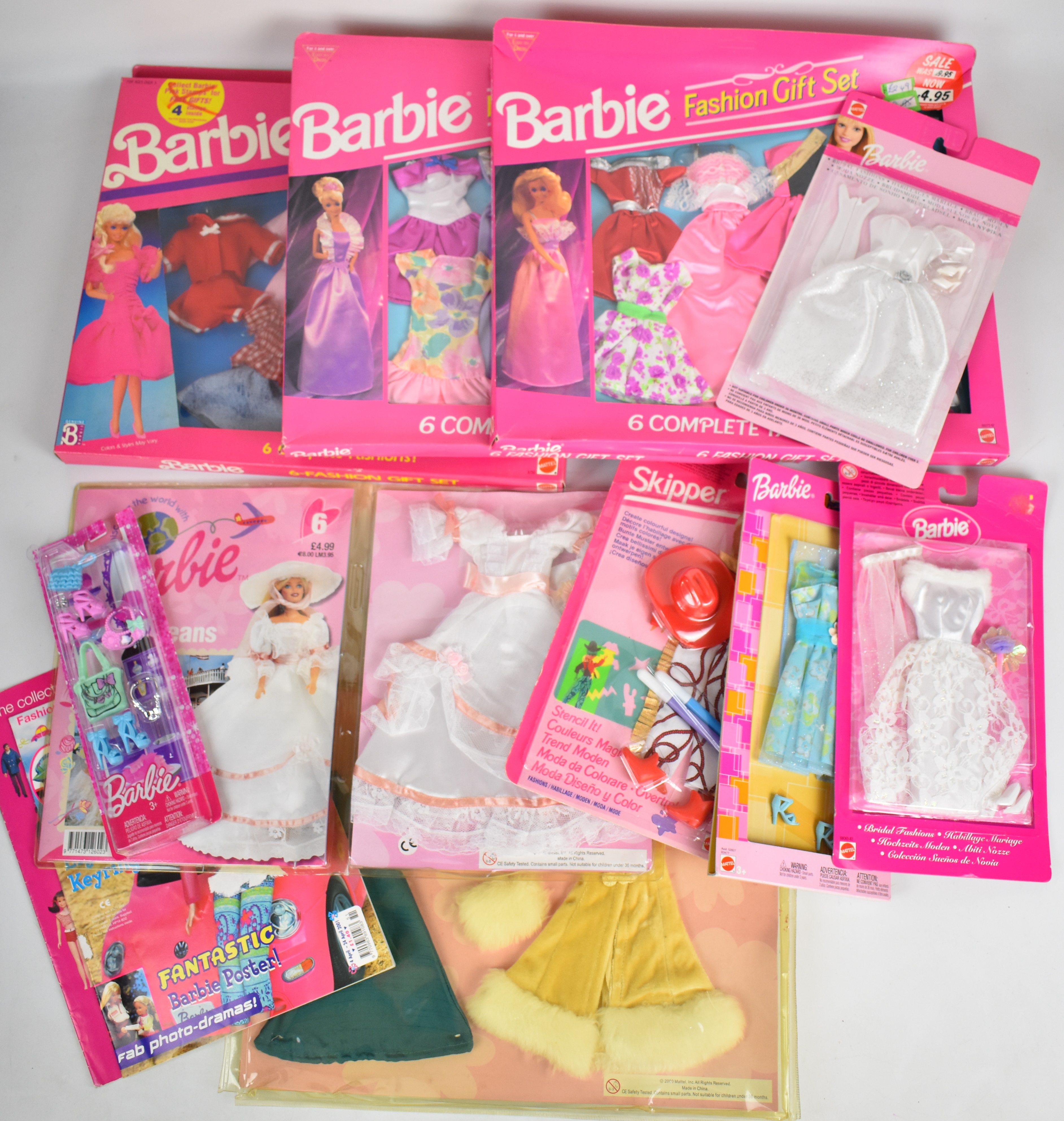 A collection of Barbie clothing and accessory sets by Mattel, all in original packaging.