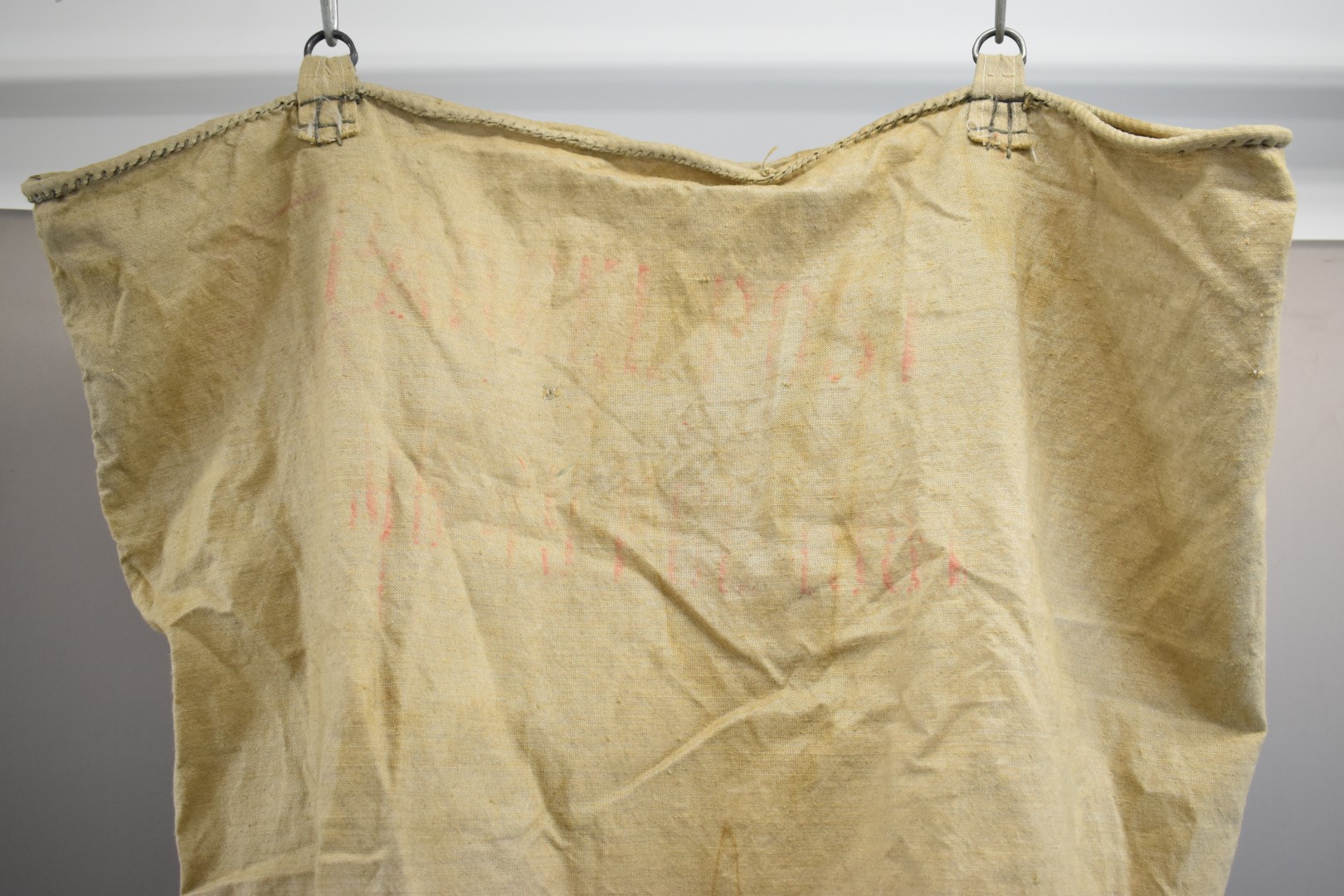 Victorian canvas post or parcel bag with metal hanging loops and VR cypher above crown, height - Image 4 of 4