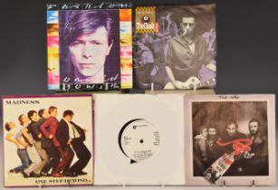 Approximately 60 UK 7" singles including Police, Madness, Kraftwerk, David Bowie, The Jam, The