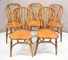 Set of five elm seated Windsor dining chairs with crinoline stretchers and hoop backs and labels