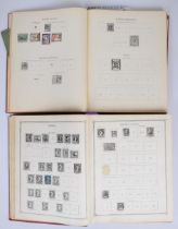 Two Ideal postage stamp albums comprising Vol 1 and Vol 2, very sparsely filled