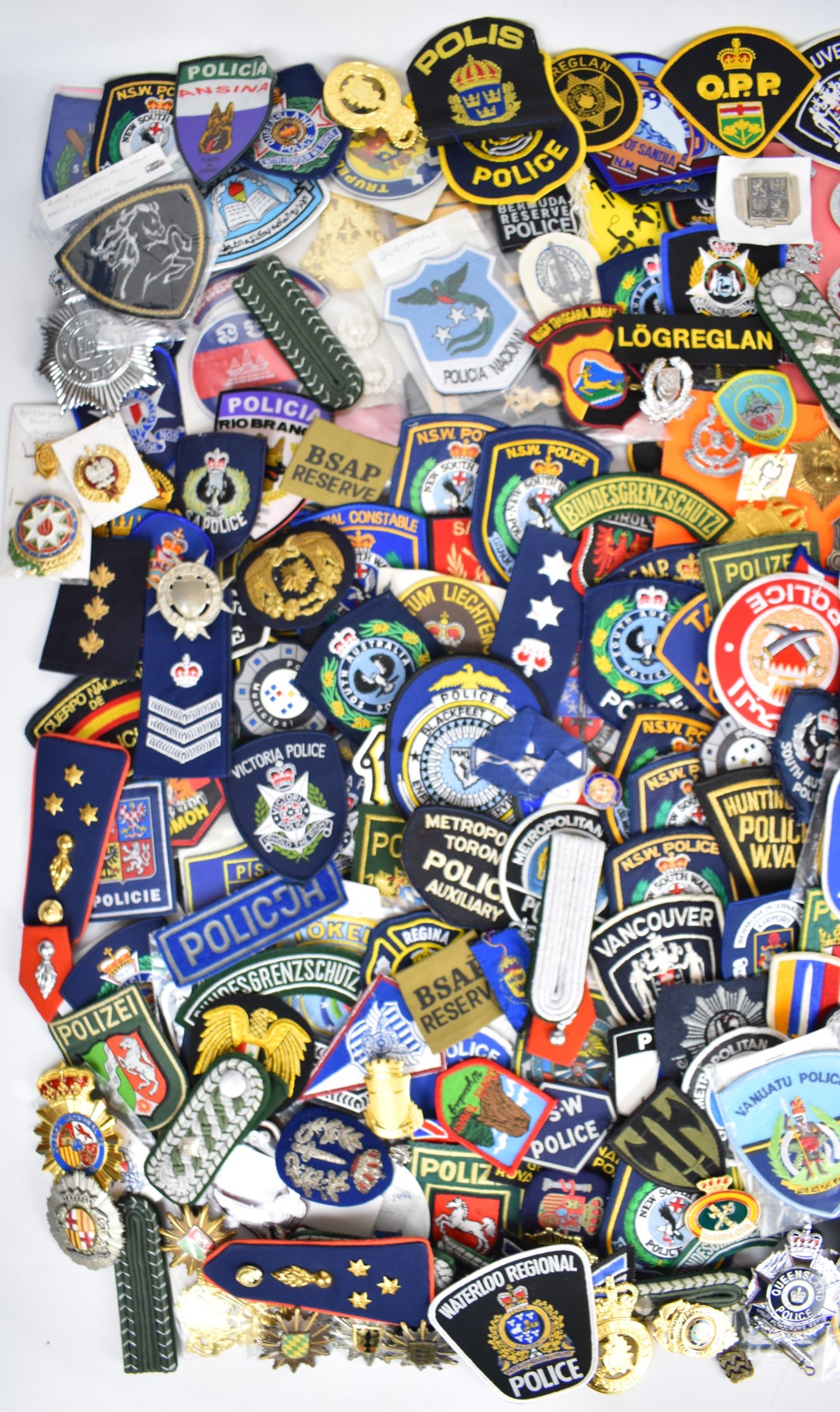 Large collection of overseas cloth and metal police badges and rank insignia including Spain, - Image 2 of 3